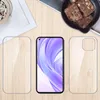 A flat lay image showing a smartphone and two protective cases on a wooden surface, with a bowl of brownies and a framed picture in the background. Anteprima dell’immagine prodotto