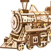A close-up view of a wooden mechanical model of a steam locomotive. Náhľad obrázku produktu