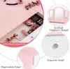 A close-up view of a pink children's vanity set, showcasing its features like a drawer with makeup, a tri-fold mirror, and decorative bows. Podgląd zdjęcia produktu