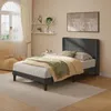 A bedroom scene featuring a bed, nightstand, and chair. Náhľad obrázku produktu