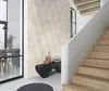 Interior hallway with a staircase and a wall decorated with wallpaper. Produktbild-Vorschau