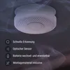 A smoke detector is shown mounted on a ceiling, with abstract smoke-like graphics in the background. Feature icons and text are displayed on the left side. Produktbild-Vorschau