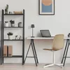 A minimalist home office setup with a desk, chair, laptop, lamp, and shelving unit. Produktbild-Vorschau