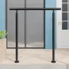 A black metal handrail is installed on a tiled patio in front of a building with blue walls and a white door. Produktbild-Vorschau