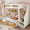 A bunk bed with stairs and drawers, decorated with stuffed animals and toys. Náhled obrázku produktu