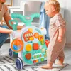 A baby is playing with a multi-functional activity walker in a room. Podgląd zdjęcia produktu