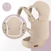 A beige baby carrier is shown with a close-up inset highlighting its features. Náhled obrázku produktu