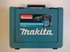 A teal plastic case for a Makita hammer drill. Podgląd zdjęcia produktu