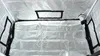 Interior view of a grow tent with reflective silver lining and black framed openings. Produktbild-Vorschau