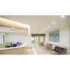 A clean, modern hospital or clinic waiting area with a reception desk and seating. Produktbild-Vorschau