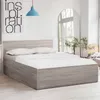 A bedroom scene with a bed, a poster, and a mirror. Náhled obrázku produktu