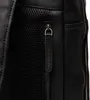 A close-up view of a black leather backpack, focusing on a zippered pocket and mesh material. Produktbild-Vorschau