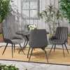An outdoor patio setting with a dining set and plants. Voir les images du produit
