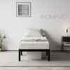 A bedroom scene with a bed, nightstand, and artwork. Voir les images du produit