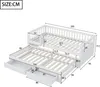 A diagram showing the dimensions of a white wooden bed with a pull-out trundle and drawers. Produktbild-Vorschau