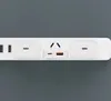 A close-up shot of a white power strip with multiple outlets and USB ports. Podgląd zdjęcia produktu