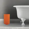 An orange pedal bin is placed next to a white bathtub in a bathroom. Náhľad obrázku produktu