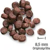 A pile of brown, pellet-shaped dog food kibble is shown on a white background. A scale bar and text indicating the size of the kibble are present. Produktbild-Vorschau