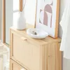 A close-up of a wooden shoe cabinet with decorative items on top. Náhľad obrázku produktu