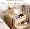 A close-up view of a wooden nightstand with two drawers, showcasing its features and storage capacity. Náhled obrázku produktu