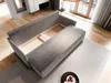 A modern living room with a sofa and a rug. Produktbild-Vorschau