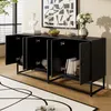 A black sideboard with its doors open, showcasing its interior storage, placed in a room with a rug and artwork. Voir les images du produit