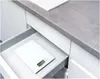 A white kitchen scale is placed in an open drawer under a gray countertop. Anteprima dell’immagine prodotto