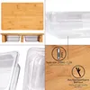 A collage of images showing a bamboo cutting board with two clear plastic containers underneath, close-ups of the containers, and detail shots of the bamboo with text overlays. Produktbild-Vorschau