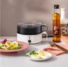 A boiled egg maker with two plates of boiled eggs and a salad. Voir les images du produit
