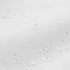 A close-up view of water droplets on a white fabric surface. Náhled obrázku produktu