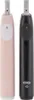 Two electric toothbrushes, one pink and one black, are shown side-by-side against a white background. Produktbild-Vorschau