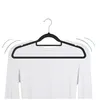 A black velvet hanger holding a white long-sleeved shirt against a white background. Produktbild-Vorschau