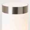 A close-up view of the top of a white cylindrical outdoor lamp with a silver band around the top. Anteprima dell’immagine prodotto