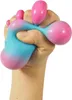 A hand squeezing a blue and pink stress ball. Voir les images du produit