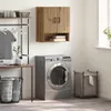 A laundry room scene with a washing machine, wall cabinet, laundry basket, and drying rack. Voir les images du produit