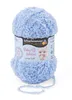 A ball of light blue, fluffy yarn with a label on it. Produktbild-Vorschau