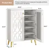 A white shoe cabinet with gold legs is shown with dimensions and shelf heights indicated. Produktbild-Vorschau
