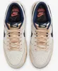 A top-down view of a pair of Nike x Stranger Things Dunk Low SP sneakers. Produktbild-Vorschau