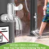 A person is washing their feet at an outdoor shower with a faucet. Produktbild-Vorschau