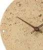 A close-up view of a round clock with a stone-like texture and brown hands. Produktbild-Vorschau