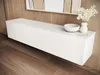 A white floating media console is mounted on a wood-paneled wall above a wooden floor. Decorative items, including a white bowl and a vase with white flowers, are placed on top of the console. Anteprima dell’immagine prodotto