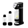 A black soda maker with two bottles, one with a lemon slice, on a white background. Produktbild-Vorschau