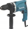 A teal and black Makita hammer drill is shown against a white background. Podgląd zdjęcia produktu