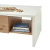 A close-up view of a modern coffee table with a drawer and an open shelf. Produktbild-Vorschau