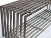 A close-up view of a metal firewood rack, showing its construction. Produktbild-Vorschau