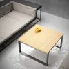 A modern outdoor living space with a sectional sofa and a square coffee table. Produktbild-Vorschau