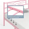 Close-up of a pink metal bed frame with a magnified inset showing the mattress support slats and arrows indicating mattress stability. Produktbild-Vorschau