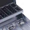 A close-up view of the coin compartments and locking mechanism of a cash box. Náhled obrázku produktu