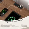 A table with a built-in charging station, showing a phone and tablet connected. Voir les images du produit