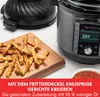 An Instant Pot Duo Crisp Multicooker with an air fryer lid and a serving of fries on a wooden board. Produktbild-Vorschau
